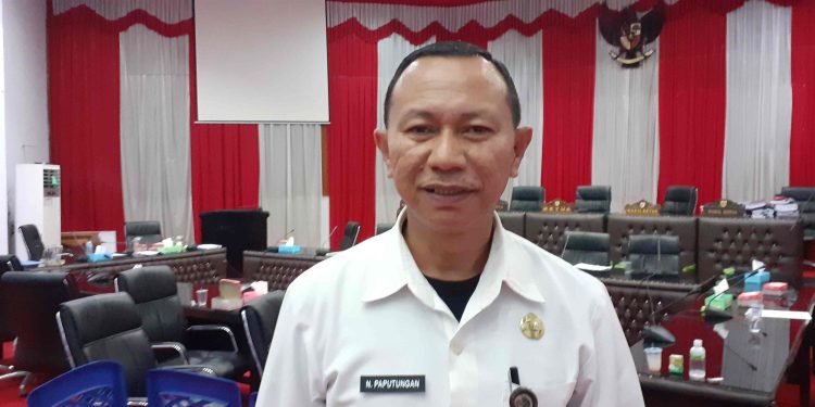 Kepala Dinas PMD Kotamobagu, Nasli Paputungan. (Foto:Kilastotabuan.com/Anggi).